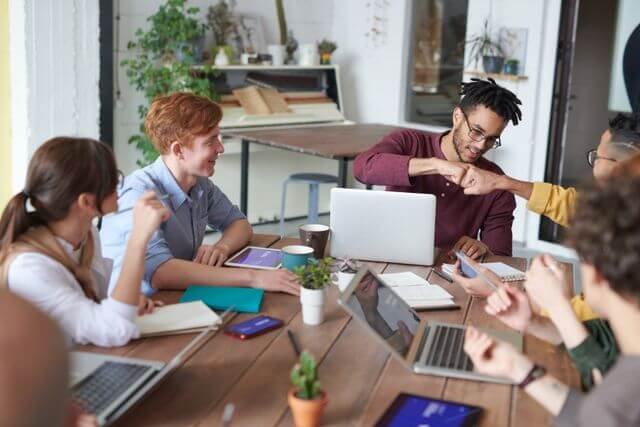 Team meeting focused on client financial support and project delivery