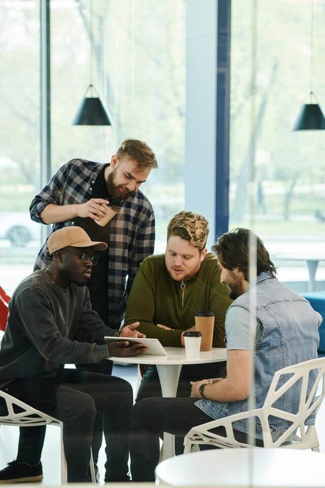 Professionals discussing business finances in a modern workplace