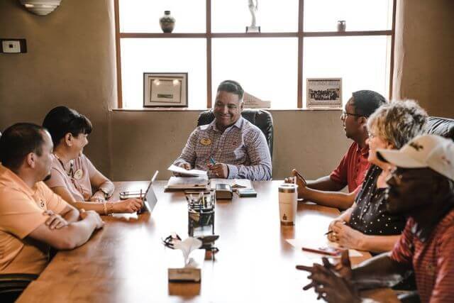 Professionals collaborating in a workplace strategy session