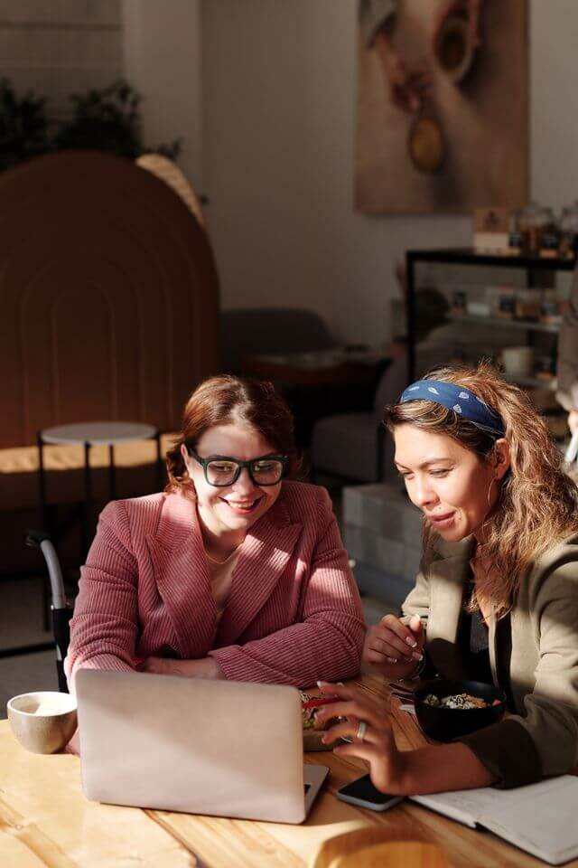 Professional reviewing documents during a financial advisory meeting