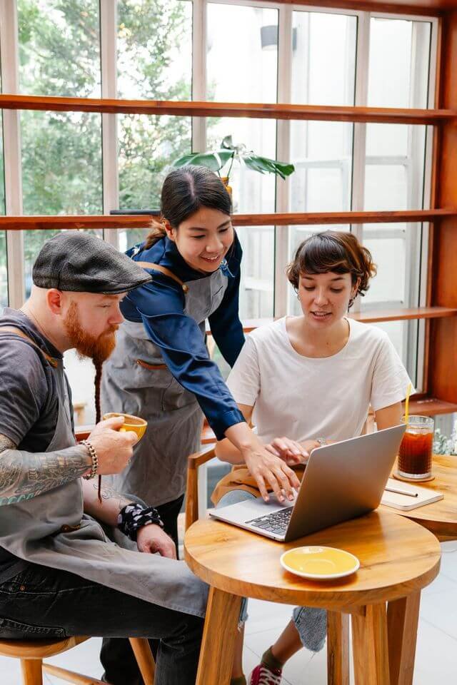 Business professionals reviewing plans during a consulting meeting
